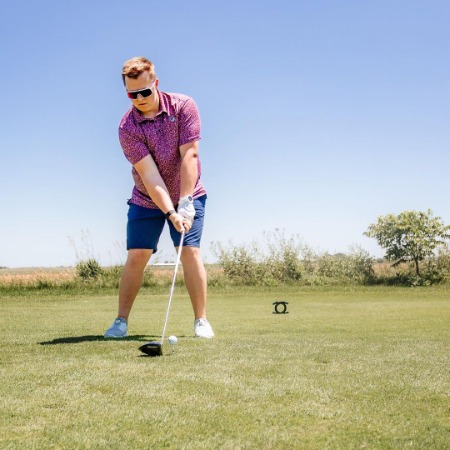 Jayden Siwa playing golf at Crandall Creek Golf Club. 
